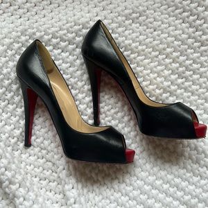 Christian LouBoutin heels! Black with red bottoms and open toed.
